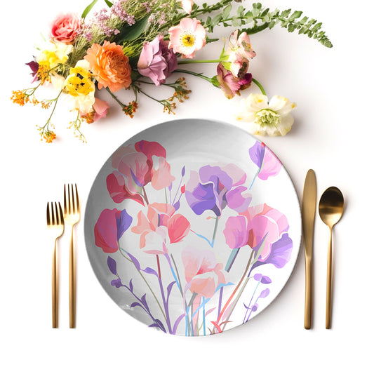 Floral-patterned sweet pea flower print plate with cutlery and flowers on a white background