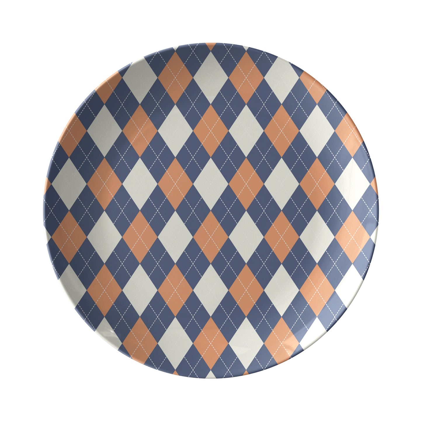 Dinner plate in an argyle diamond pattern in orange, navy and cream.