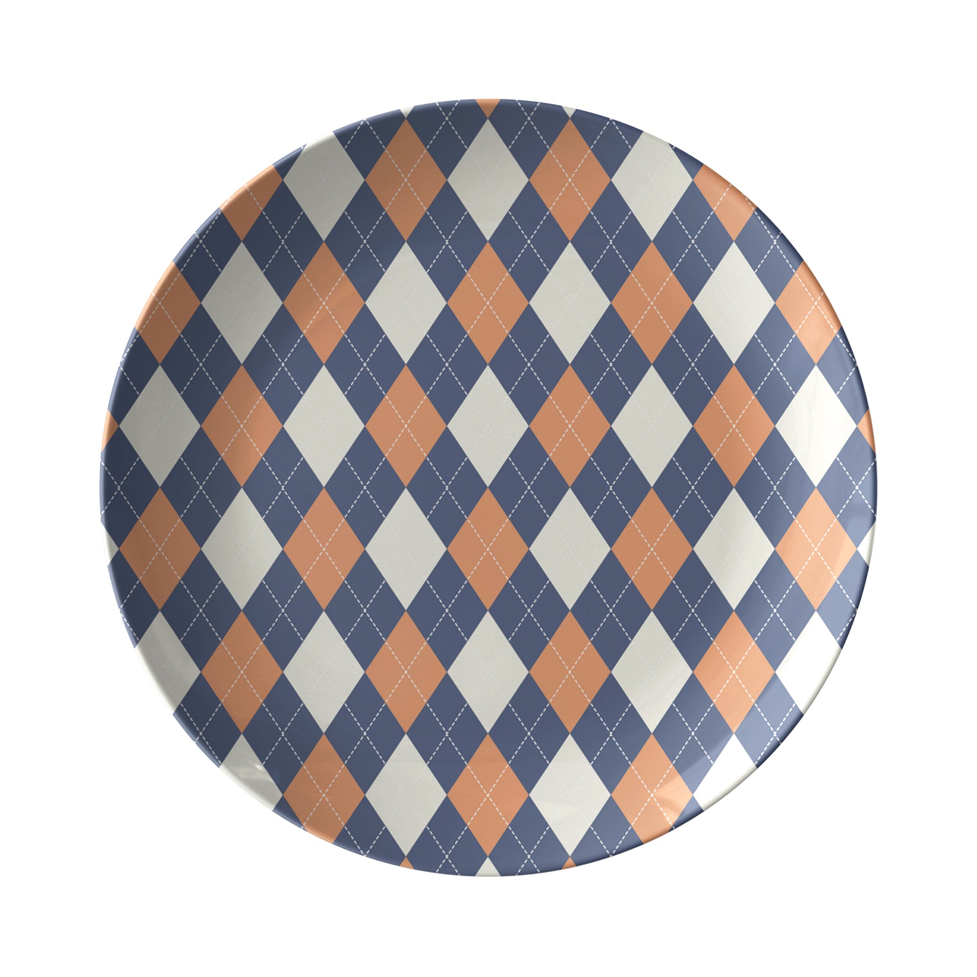Dinner plate in an argyle diamond pattern in orange, navy and cream.