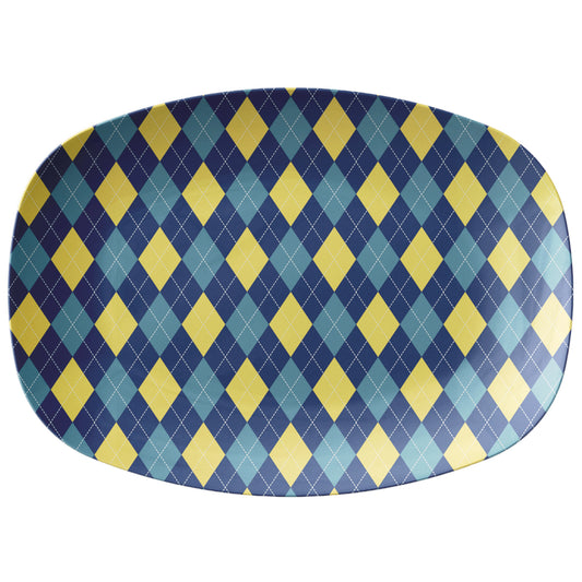Oval serving platter with an argyle pattern in navy, yellow and teal.