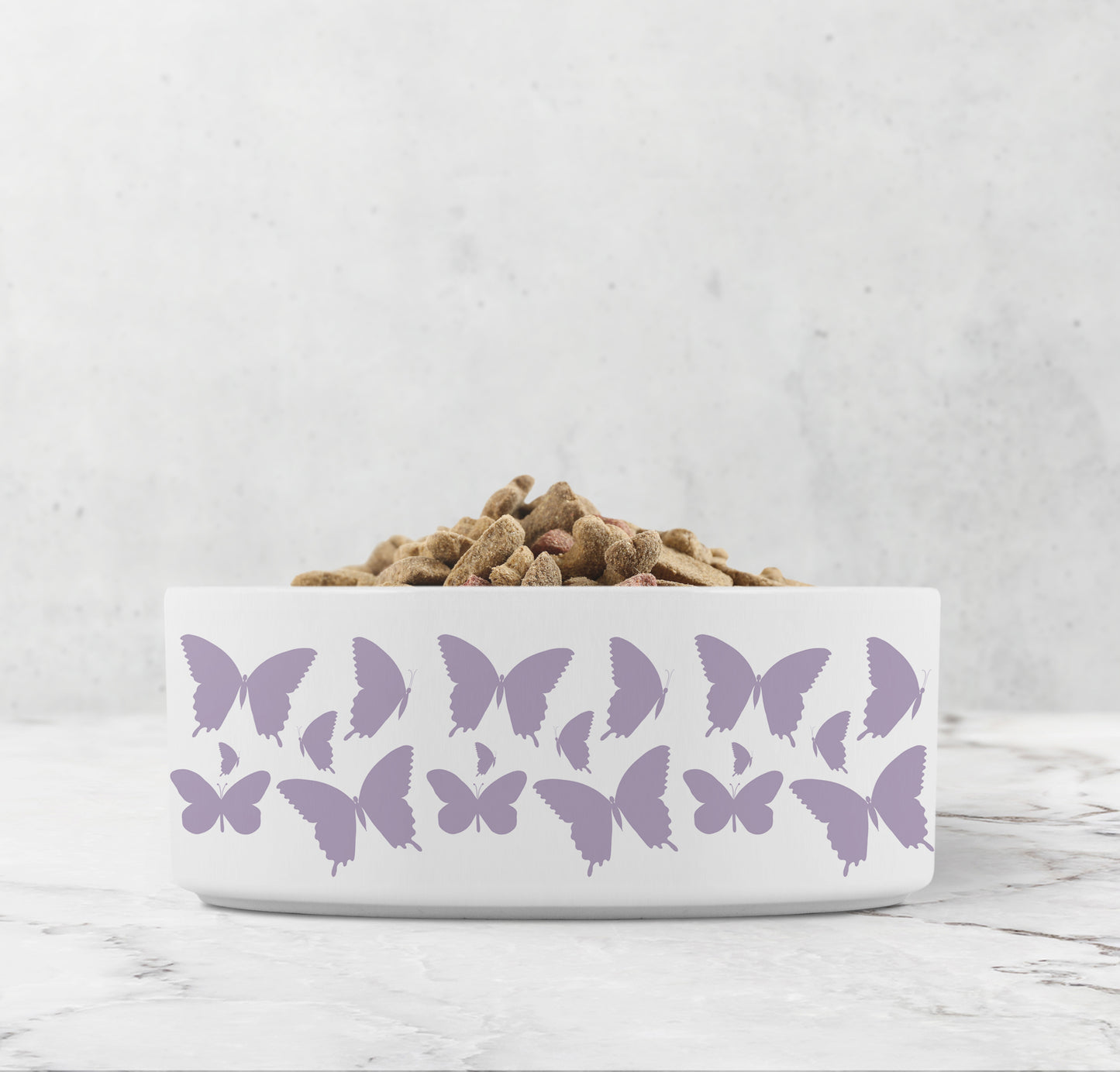 Hand drawn purple lavender butterflies are printed on a white ceramic pet dish.