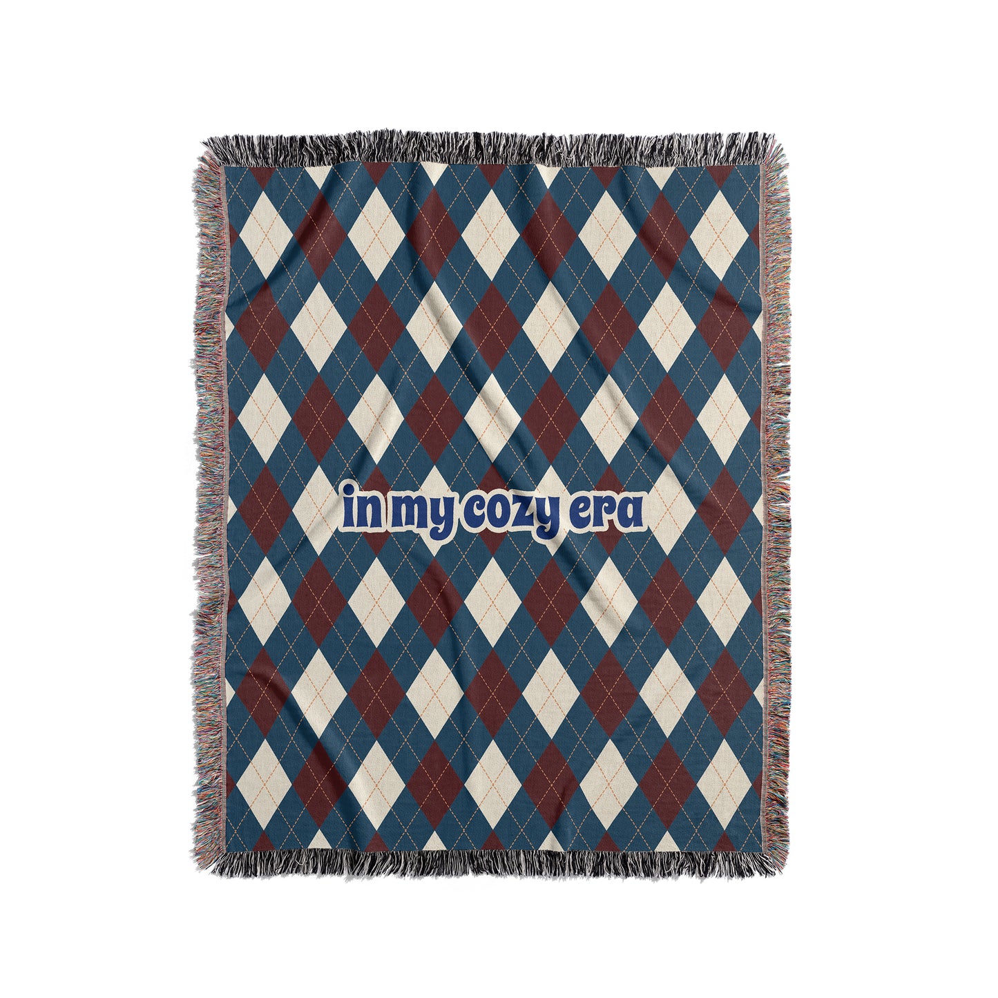 Argyle blanket that says In My Cozy Era, blue, red and cream.
