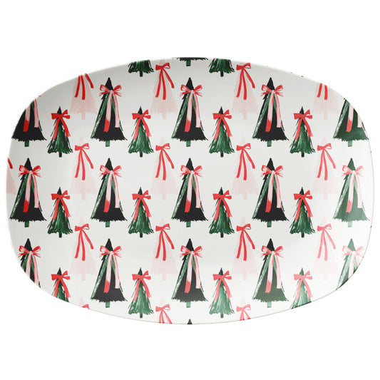 Oval-shaped plate with Christmas tree and bow pattern on a white background