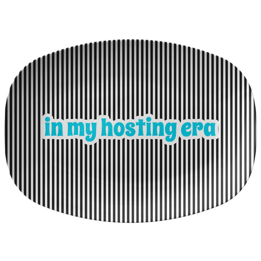 Black and white striped serving platter with text that says in my hosting era.