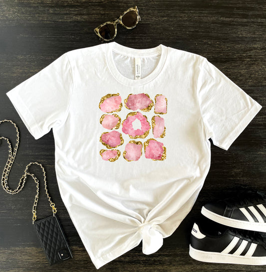 Rose Quartz Crystals Spiritual Tshirt for Women. White short sleeve shirt with rose quartz birthstone print with gold accents.