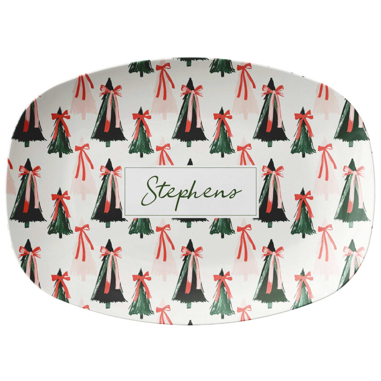 Decorative serving plate with Christmas tree and bow pattern on a white background
