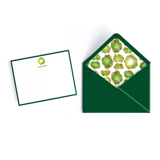 Luxury personalized notecard, white with green border and custom name, peridot birthstone jewel and green envelope lined with gemstone collage print design.