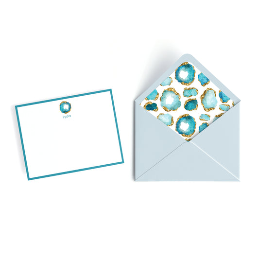Personalized stationery set with a flat card and envelope featuring blue gemstone pattern on a white background