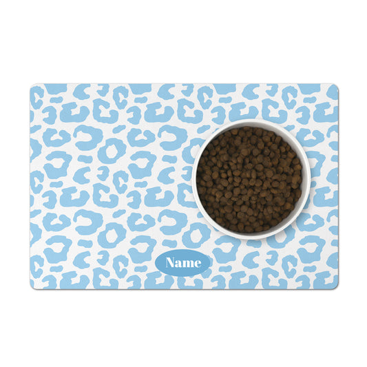 Personalized pet bowl mat in a baby blue and white leopard pattern. Perfect custom pet gift for dogs or cats.