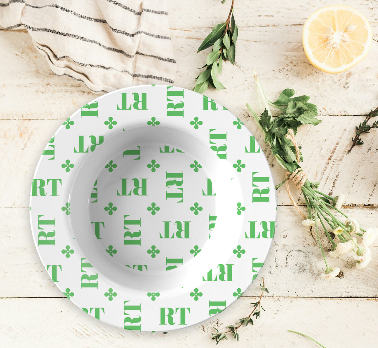 Personalized White and Green Monogrammed Bowl features customized initials set in a repeating pattern accented with a stylish motif for an all-over, unique design.