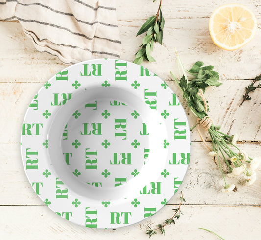 Personalized White and Green Monogrammed Bowl features customized initials set in a repeating pattern accented with a stylish motif for an all-over, unique design.