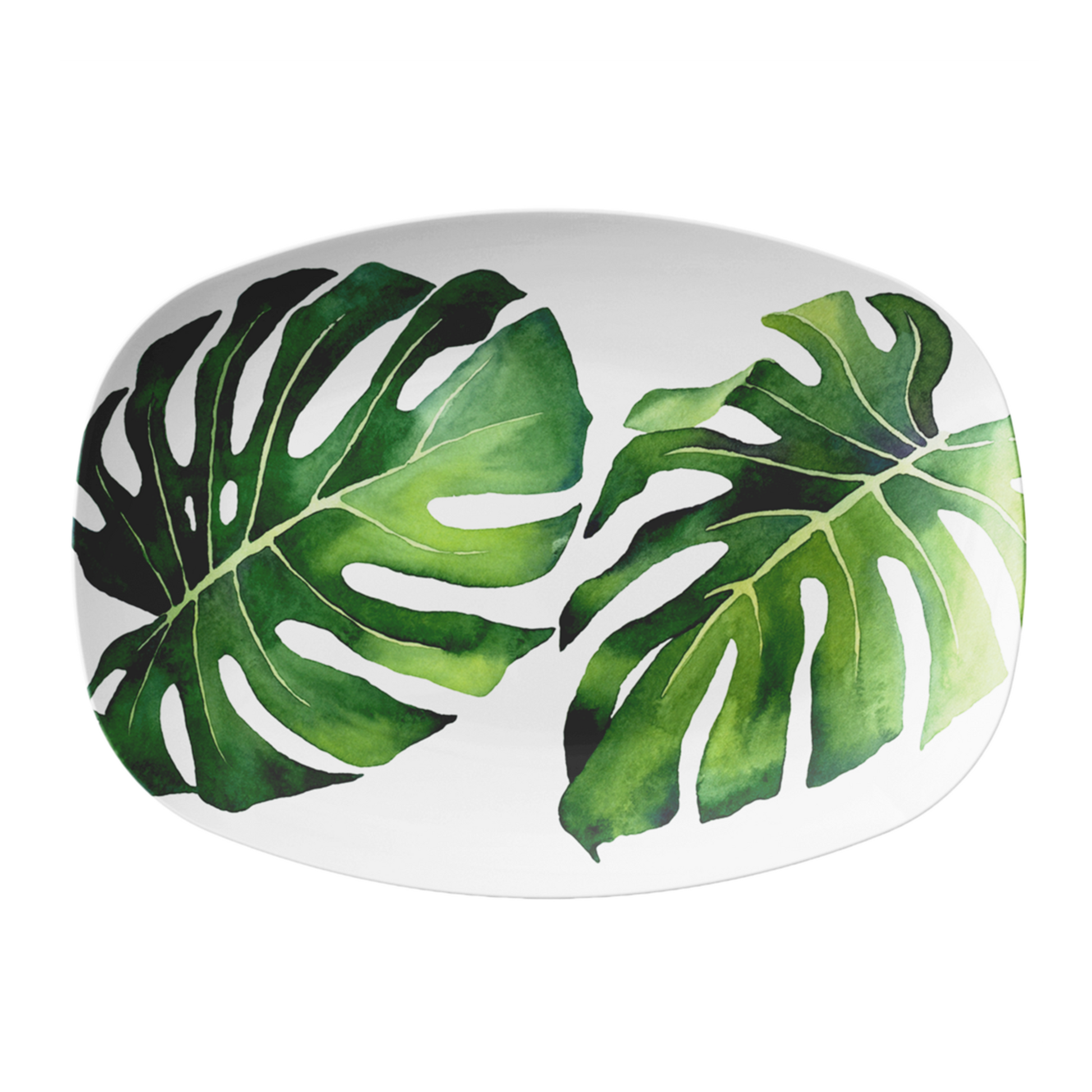Oval white platter with green monstera leaf pattern on a white background