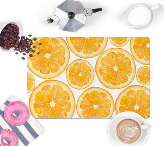 Colorful kitchen counter mat has sliced oranges pattern on one side and nonskid rubber back.