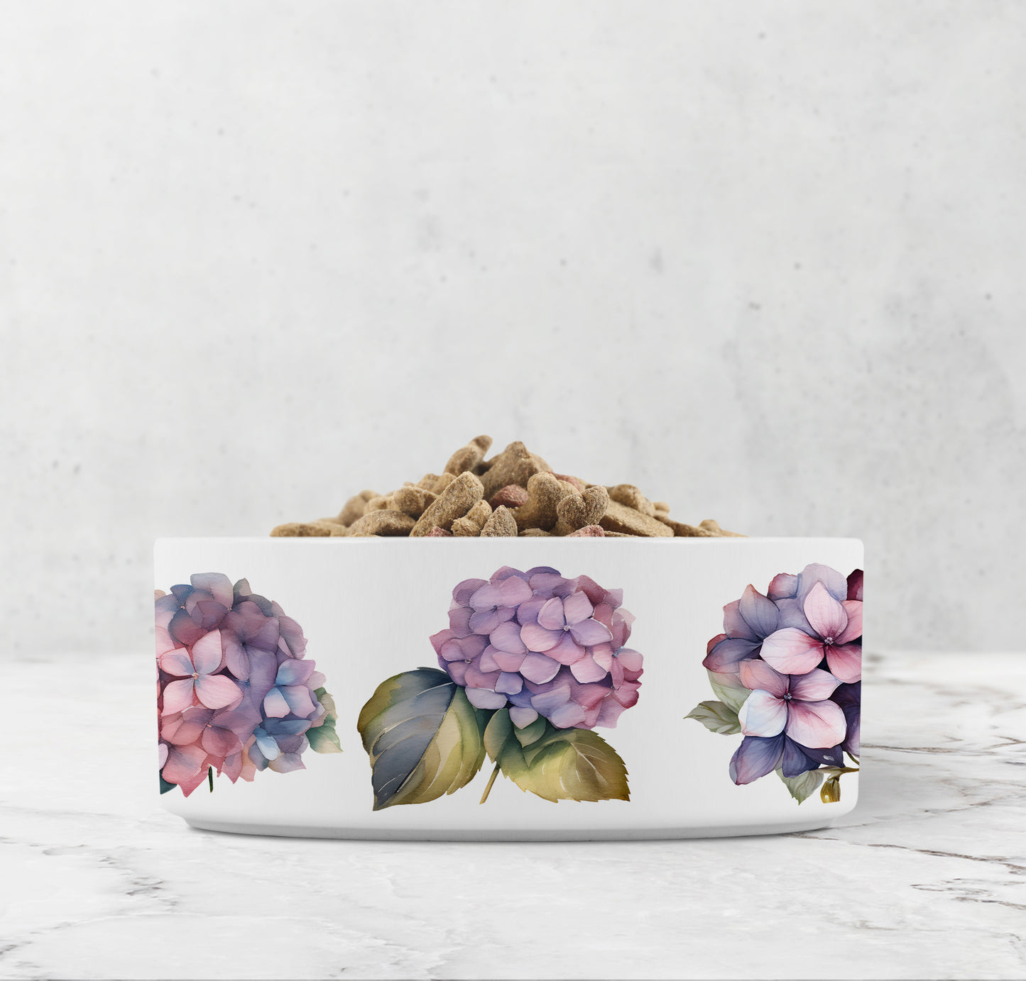 White pet bowl with floral design on a marble surface