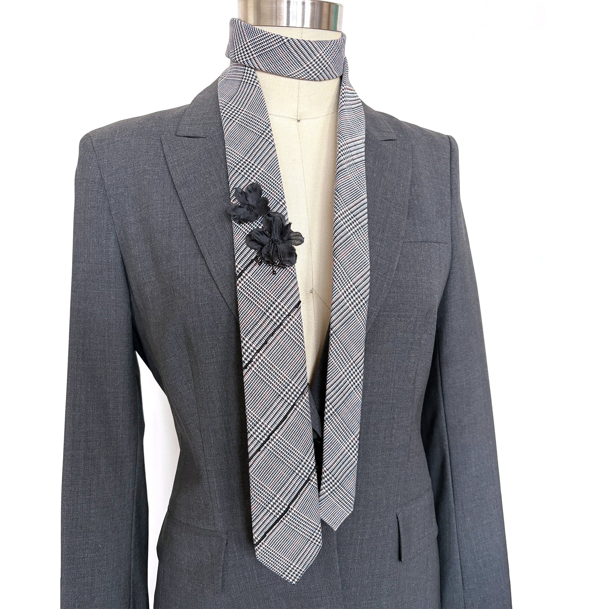 Black & White Plaid Skinny Necktie upcycled with beads embroidery and flowers with French Knots on mannequin with grey blazer.