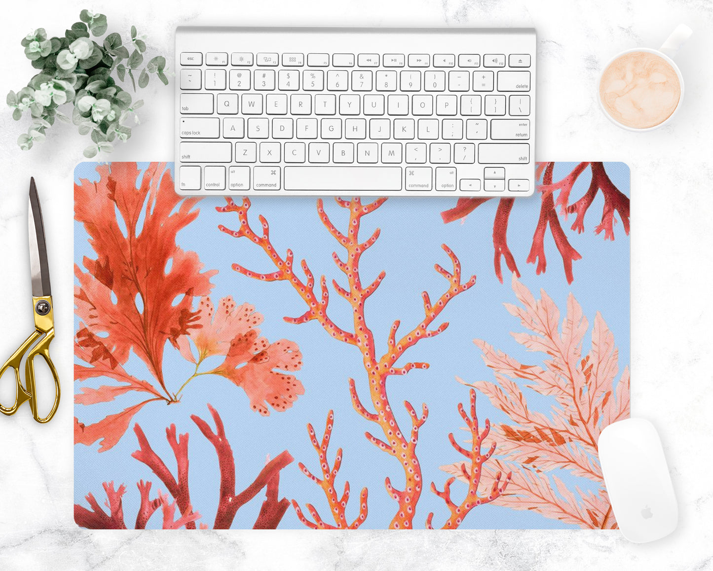 Ocean coral desk mat features red, orange and pink sea coral printed on sky blue mat. May also be used as a counter trivet or bar mat.