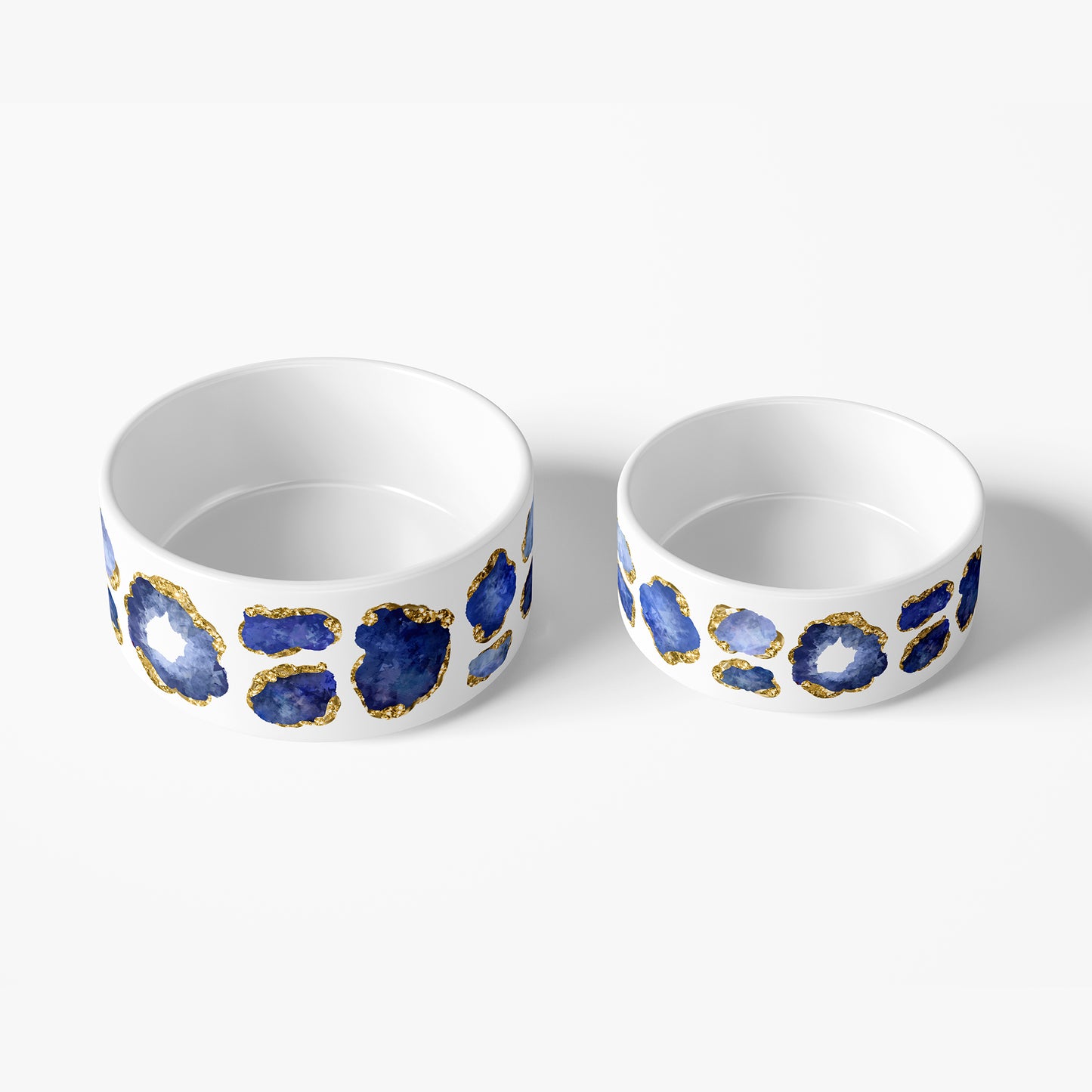Large and small white ceramic pet bowls with dark blue gemstone and gold print