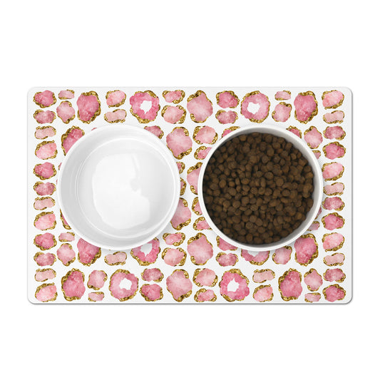 Pretty pink and gold gemstones are printed on this dog bowl mat.