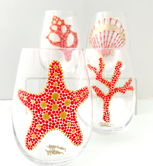 Alyssa Reuven Hand Painted Nautical Glassware. Coastal living tabletop. Set of four sea themed stemless wine glasses in coral and gold.