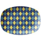 Oval serving platter with an argyle pattern in navy, yellow and teal.