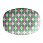 Oval serving platter with an argyle diamond motif pattern in pink, green and cream.