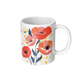 White mug with floral design featuring red and pink poppy flowers on a white background