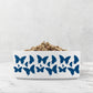 Hand drawn indigo blue butterflies are printed on a white ceramic dog or cat  bowl.