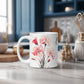 White mug with floral design on a kitchen counter