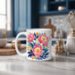 White mug with peony birth month floral design on a kitchen counter