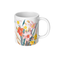 White coffee cup with daffodil floral design on a white background
