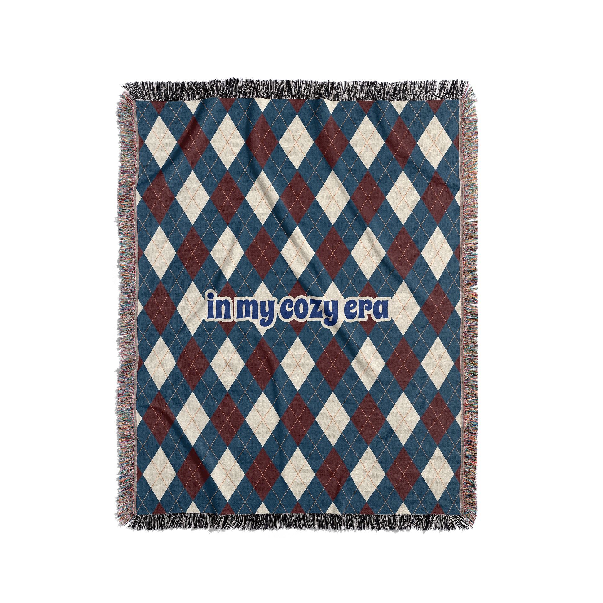 Argyle blanket that says In My Cozy Era, blue, red and cream.