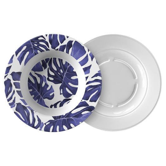 Plastic rimmed pasta soup salad bowl with modern monstera leaf print in dark blue and white.