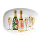 White oval serving platter featuring elegant champagne bottles, gold-accented champagne flutes, and shimmering loose gemstones scattered throughout, creating a beautiful touch of sparkle and sophistication. Customize the main champagne bottle label with names, a date, or your own special message.