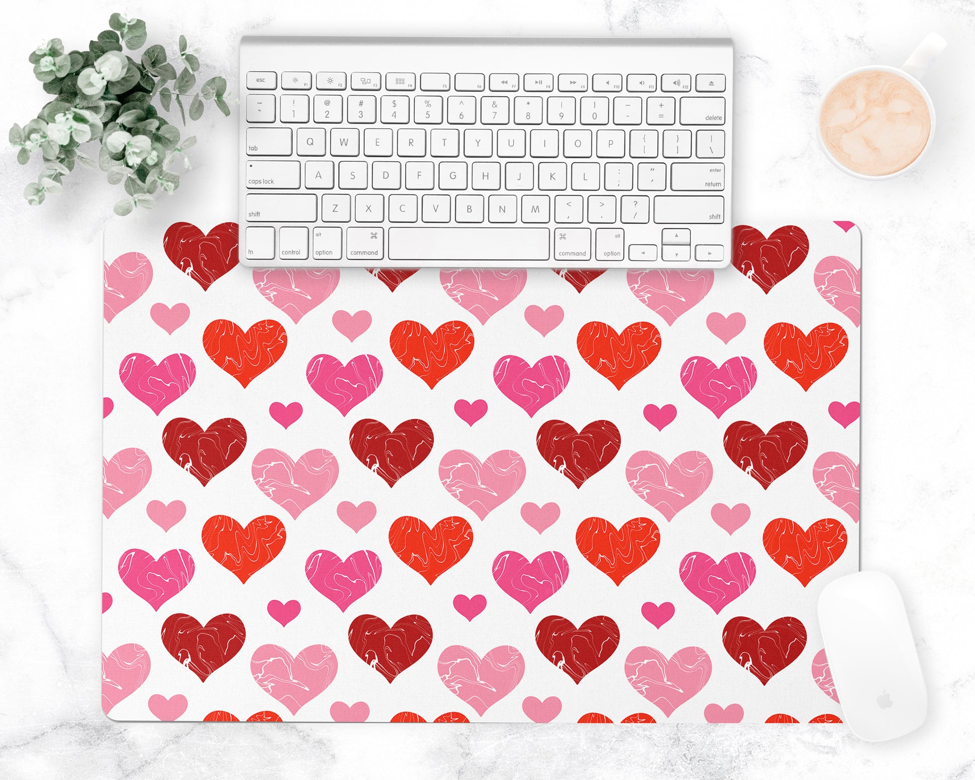 All over hearts pattern is printed on a white desk pad or counter mat.