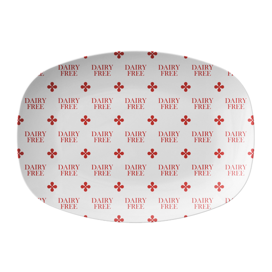 Round white label with 'DAIRY FREE' text and red clover motif on a white background