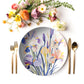Iris Floral-patterned plate with cutlery and flowers on a white background