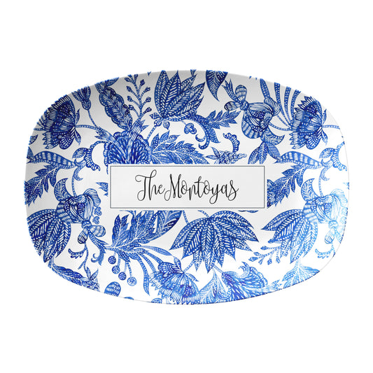 Decorative serving platter with blue floral pattern and custom text on a white background