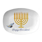 White serving platter with gold menorah and blue bird design, featuring 'Happy Hanukkah' text.