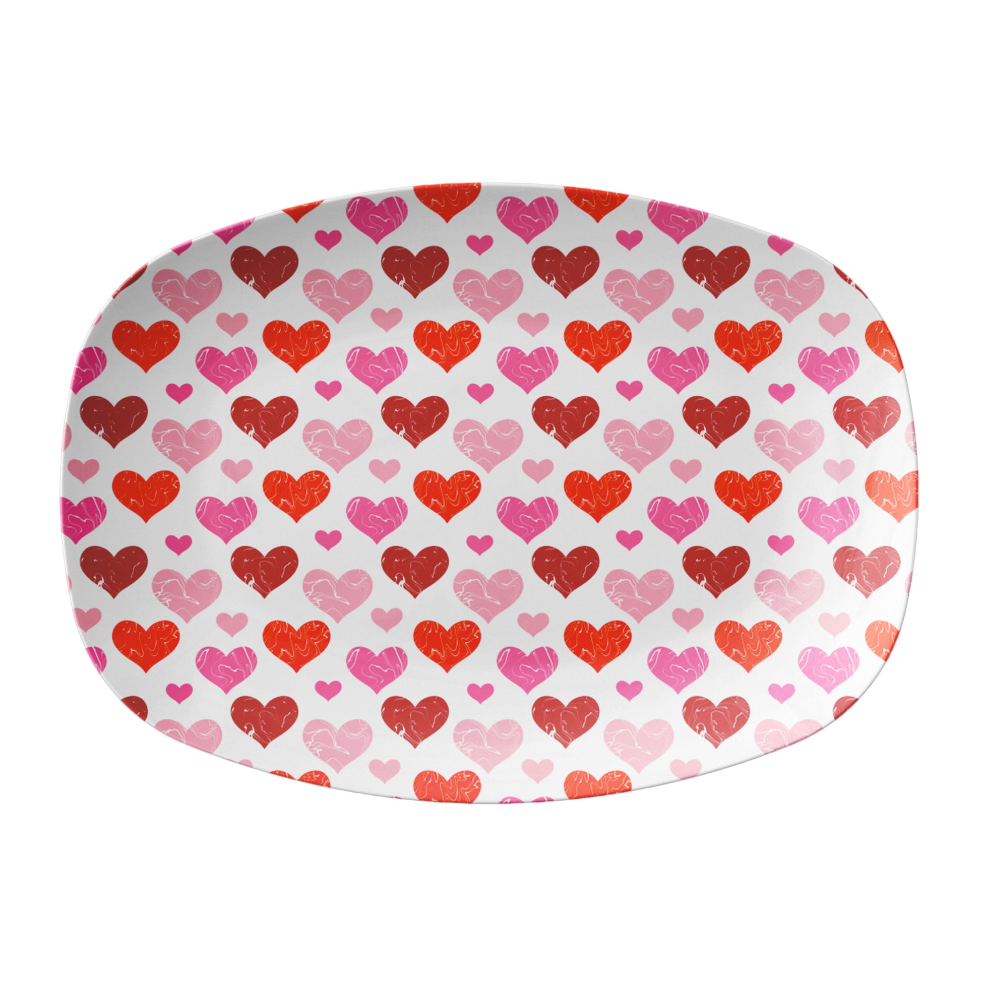 Oval-shaped serving platter with a pattern of red and pink hearts on a white background