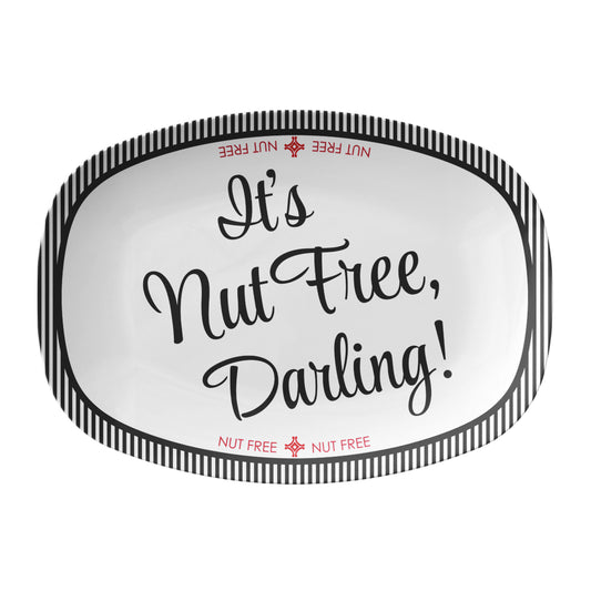 White oval serving platter labeled with 'It's Nut Free, Darling!' text and stripes on a white background