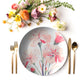 Carnation floral print dinner plate with gold cutlery and fresh flowers.