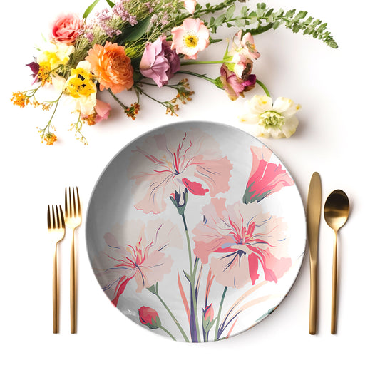 Carnation floral print dinner plate with gold cutlery and fresh flowers.