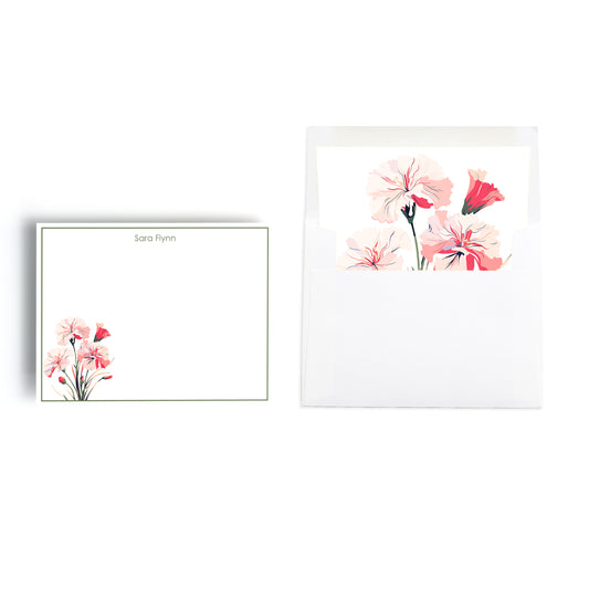 Birth month carnation flower print stationery white notecard set with custom monogram and a lined envelope featuring the same floral print. 