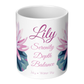 White mug with pink floral design and text on a white background