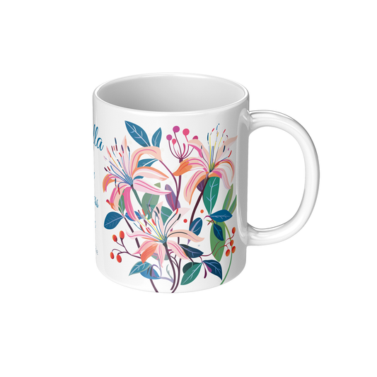 White coffee mug with colorful honeysuckle floral design on a white background