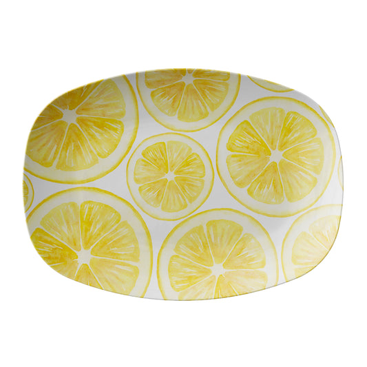 Oval-shaped platter with lemon slice pattern on a white background