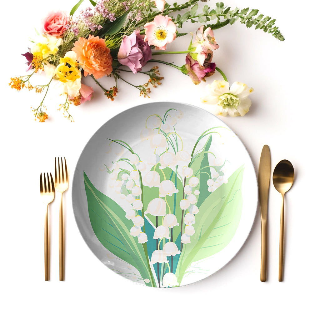 Lily of the Valley floral print plate dining table setting with cutlery and flowers.