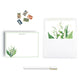 Personalized lily of the valley note cards with floral design, stamps, and a pen on a white background. envelope is hand lined with floral print paper.