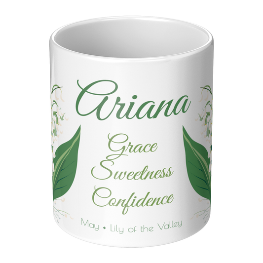 White mug with green text and leaf designs on a white background