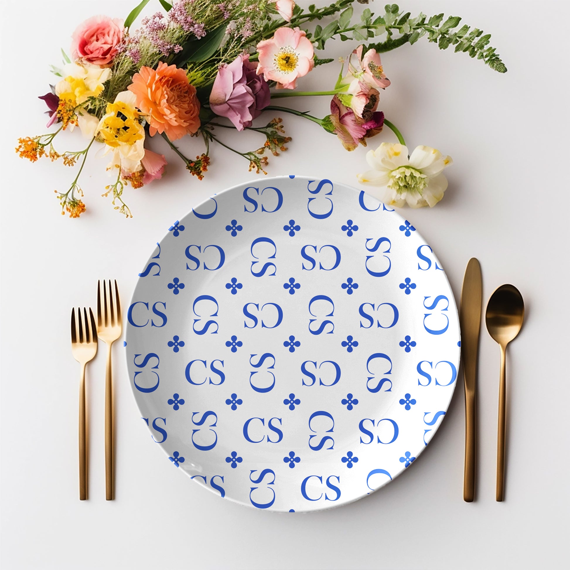 Personalized White and Blue Stylized Monogram Plate features customized initials set in a repeating pattern accented with a stylish motif for an all-over, unique custom design.